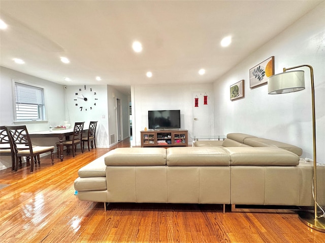 20426 45th Dr, Bayside, NY 11361 - living room featuring wood finished floors and recessed lighting