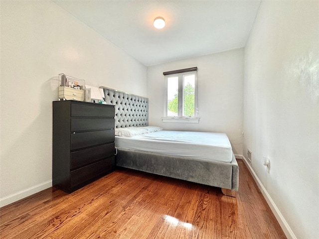 20426 45th Dr, Bayside, NY 11361 - bedroom with wood finished floors and baseboards
