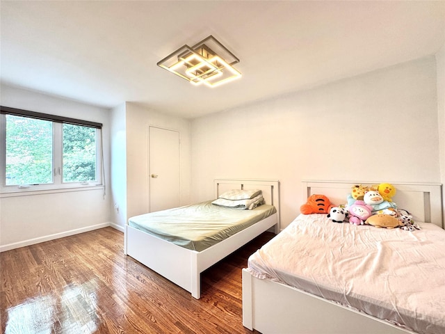 20426 45th Dr, Bayside, NY 11361 - bedroom featuring wood finished floors and baseboards