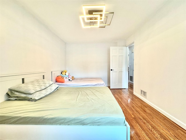 20426 45th Dr, Bayside, NY 11361 - bedroom with wood finished floors and baseboards