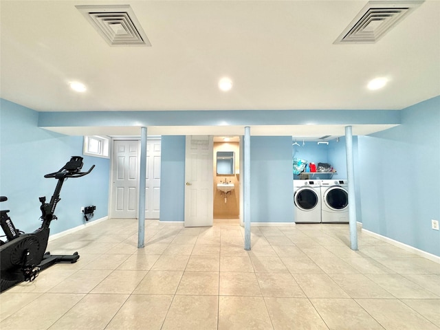 20426 45th Dr, Bayside, NY 11361 - finished below grade area with washing machine and dryer, recessed lighting, baseboards, tile patterned floors, and a sink