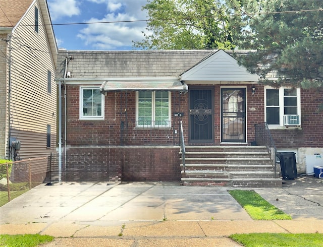 20426 45th Dr, Bayside, NY 11361 - view of front of house with brick siding and cooling unit