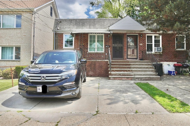 20426 45th Dr, Bayside, NY 11361 - view of front of property with brick siding and cooling unit