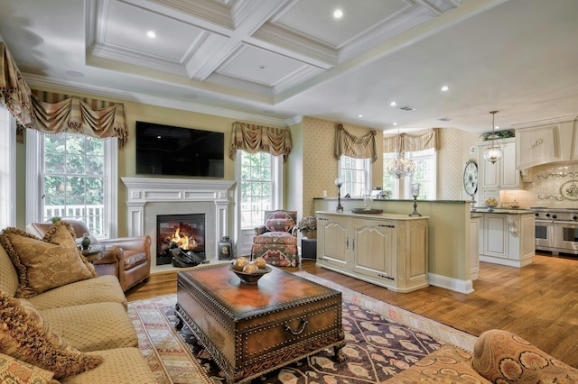 21 Hathaway Ln, Manhasset, NY 11030 - living area featuring crown molding, light wood-style flooring, a glass covered fireplace, beamed ceiling, and coffered ceiling