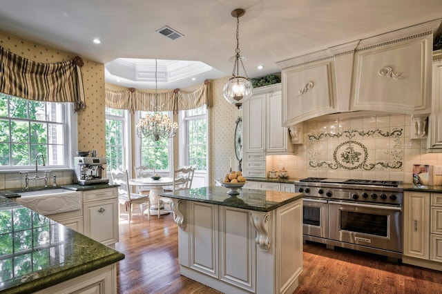 21 Hathaway Ln, Manhasset, NY 11030 - kitchen with double oven range, a sink, dark wood finished floors, a center island, and backsplash
