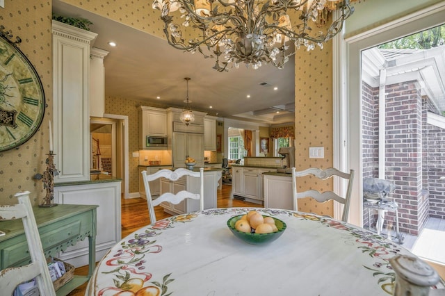 21 Hathaway Ln, Manhasset, NY 11030 - dining space featuring wallpapered walls, light wood-style flooring, and a chandelier