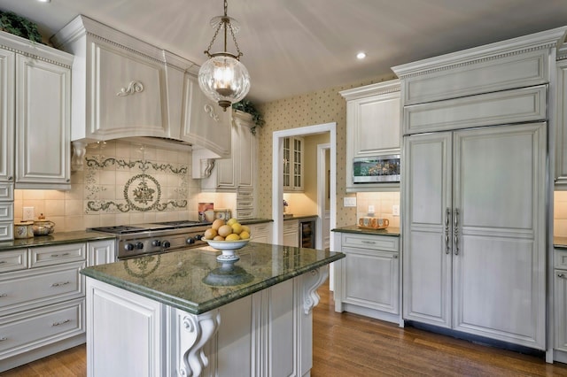 21 Hathaway Ln, Manhasset, NY 11030 - kitchen featuring built in appliances, beverage cooler, decorative backsplash, dark wood-type flooring, and a kitchen island