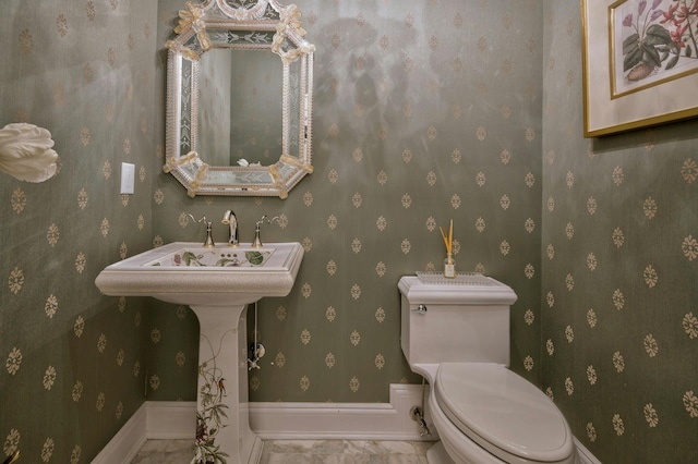 21 Hathaway Ln, Manhasset, NY 11030 - bathroom featuring toilet and baseboards