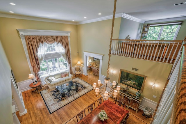 21 Hathaway Ln, Manhasset, NY 11030 - living room with healthy amount of natural light, wood finished floors, recessed lighting, crown molding, and baseboards