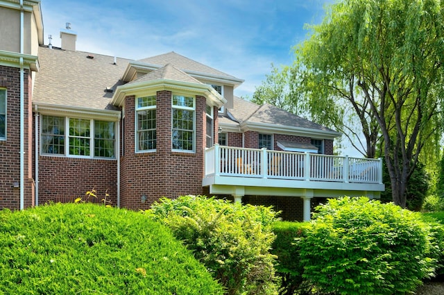 21 Hathaway Ln, Manhasset, NY 11030 - back of house featuring brick siding and a shingled roof