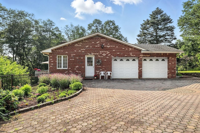 3 David Rd, Somers, NY 10589 - view of front of property featuring decorative driveway, an attached garage, and brick siding