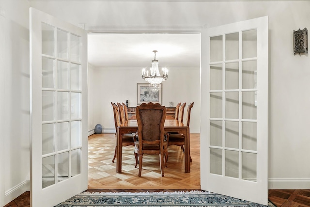 3 David Rd, Somers, NY 10589 - dining room with a chandelier, french doors, a baseboard radiator, ornamental molding, and a baseboard heating unit