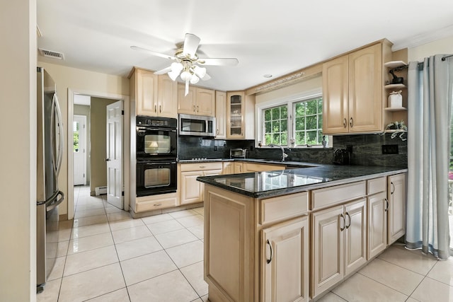 3 David Rd, Somers, NY 10589 - kitchen featuring stainless steel appliances, light brown cabinetry, a peninsula, and decorative backsplash