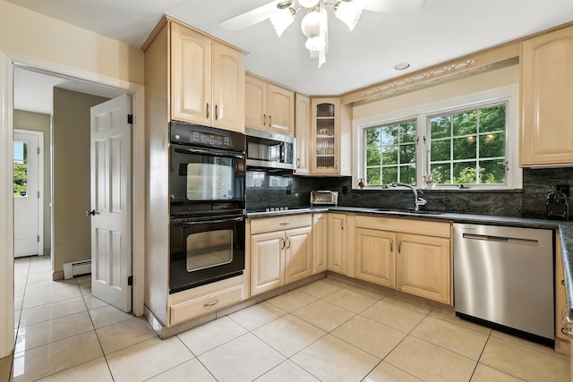 3 David Rd, Somers, NY 10589 - kitchen with black appliances, light brown cabinets, light tile patterned floors, baseboard heating, and decorative backsplash