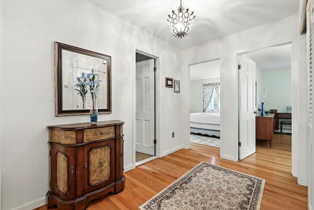 3 David Rd, Somers, NY 10589 - hall with light wood-type flooring and a chandelier