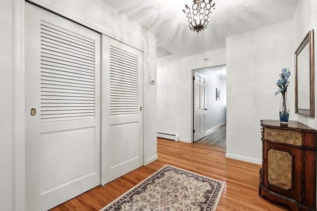 3 David Rd, Somers, NY 10589 - hallway with a baseboard radiator and light wood-style flooring