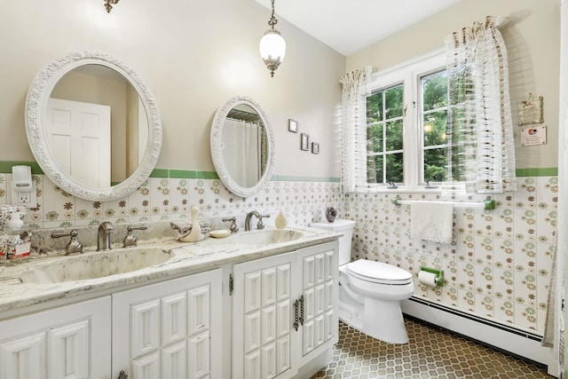 3 David Rd, Somers, NY 10589 - bathroom with a baseboard heating unit, double vanity, wainscoting, and tile patterned floors