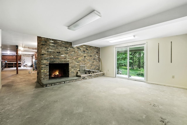 3 David Rd, Somers, NY 10589 - unfurnished living room featuring unfinished concrete flooring, a fireplace, and beam ceiling
