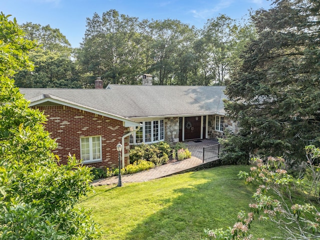 3 David Rd, Somers, NY 10589 - single story home with a front lawn, a chimney, roof with shingles, brick siding, and stone siding