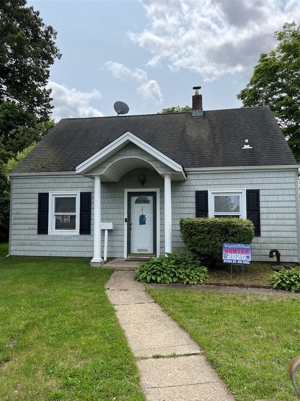 2 Anvil Ln, Levittown, NY 11756 - bungalow-style home featuring a chimney, a front lawn, and a shingled roof