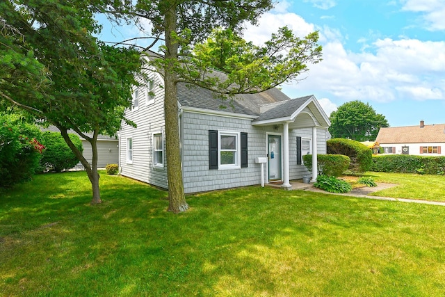 2 Anvil Ln, Levittown, NY 11756 - view of front of home featuring a shingled roof and a front lawn