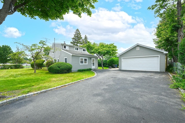 2 Anvil Ln, Levittown, NY 11756 - view of side of property featuring a garage, an outdoor structure, and a yard