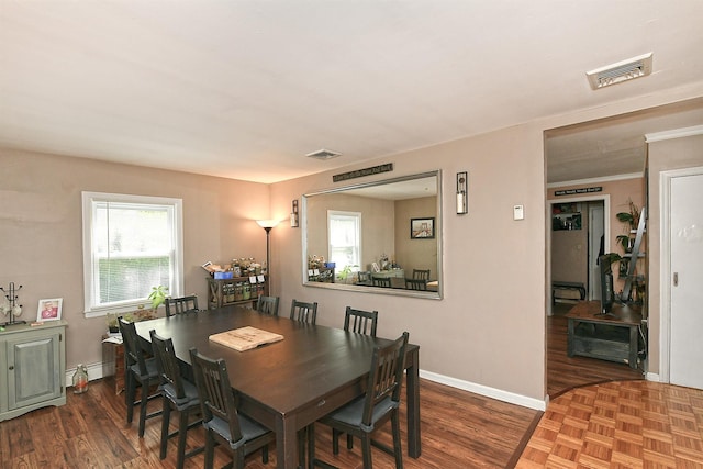 2 Anvil Ln, Levittown, NY 11756 - dining room with healthy amount of natural light, baseboards, and baseboard heating