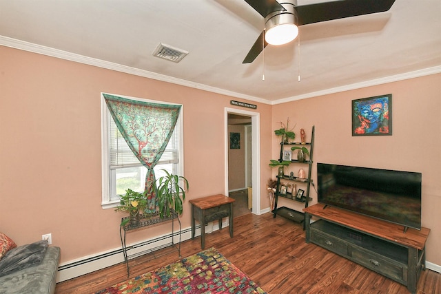 2 Anvil Ln, Levittown, NY 11756 - living area with a baseboard heating unit, crown molding, wood finished floors, a ceiling fan, and baseboards