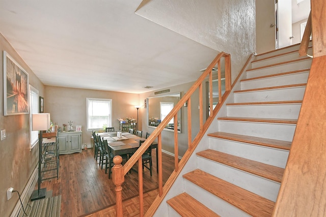 2 Anvil Ln, Levittown, NY 11756 - dining space featuring stairway and wood finished floors