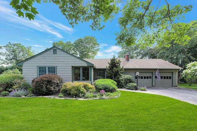 43 Sound Rd, Greenport, NY 11944 - ranch-style home with a chimney, driveway, a front lawn, and an attached garage
