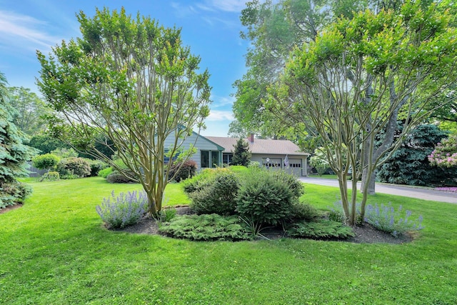 43 Sound Rd, Greenport, NY 11944 - view of front of property featuring an attached garage, a front yard, and driveway
