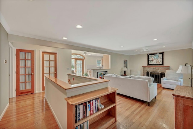 43 Sound Rd, Greenport, NY 11944 - living room featuring ceiling fan, a fireplace, light wood-type flooring, ornamental molding, and recessed lighting