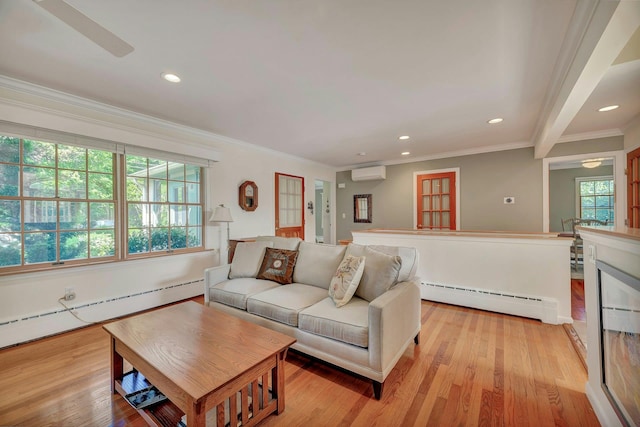 43 Sound Rd, Greenport, NY 11944 - living area featuring a baseboard heating unit, a wall unit AC, recessed lighting, crown molding, and light wood finished floors