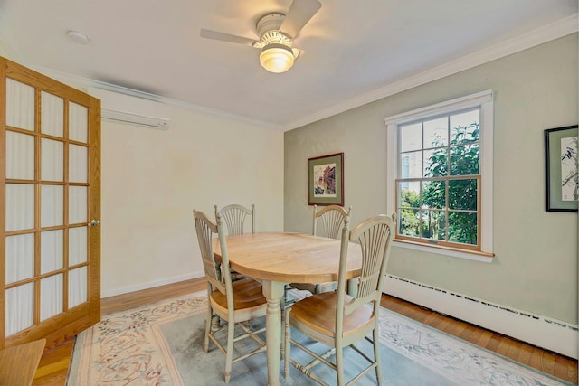 43 Sound Rd, Greenport, NY 11944 - dining room featuring baseboard heating, a wall mounted air conditioner, wood finished floors, crown molding, and ceiling fan