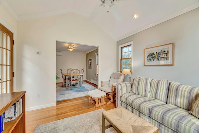 43 Sound Rd, Greenport, NY 11944 - living area featuring a ceiling fan, light wood-style floors, crown molding, vaulted ceiling, and a wall unit AC