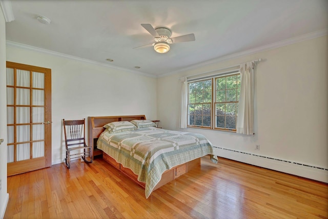 43 Sound Rd, Greenport, NY 11944 - bedroom with light wood-style floors, crown molding, and a baseboard heating unit