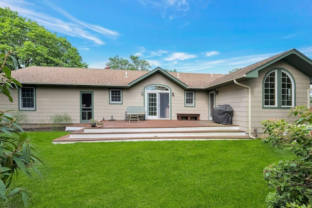 43 Sound Rd, Greenport, NY 11944 - rear view of house with a yard, a wooden deck, and roof with shingles