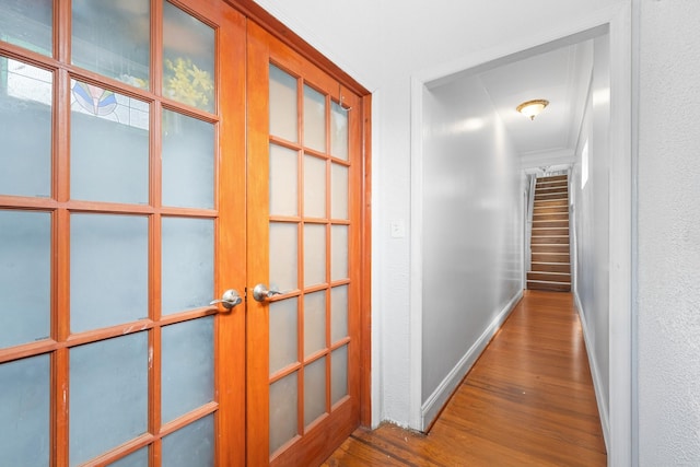 11401 115th St, South Ozone Park, NY 11420 - hall with french doors, wood finished floors, and baseboards