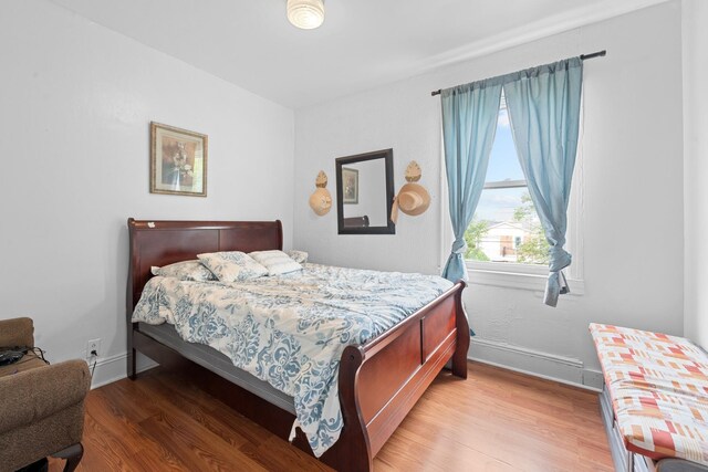 11401 115th St, South Ozone Park, NY 11420 - bedroom featuring light wood finished floors and baseboards