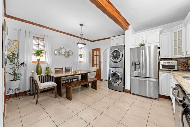 11401 115th St, South Ozone Park, NY 11420 - dining room featuring stacked washer / dryer, light tile patterned floors, beamed ceiling, and baseboards