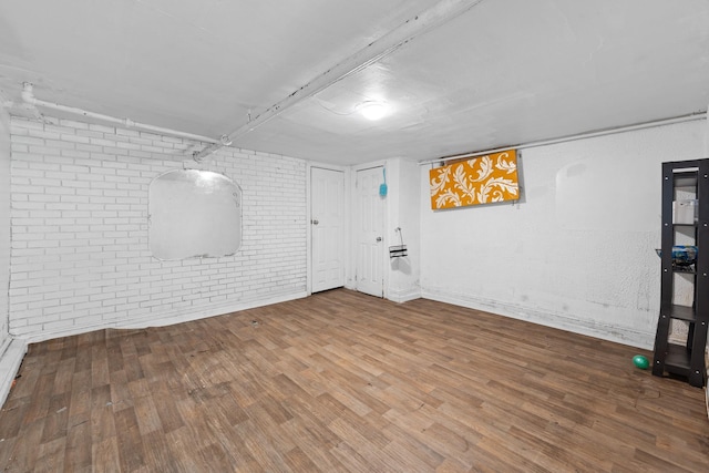 11401 115th St, South Ozone Park, NY 11420 - finished below grade area featuring brick wall, wood finished floors, and baseboards