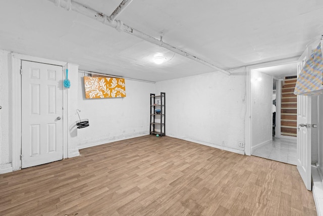 11401 115th St, South Ozone Park, NY 11420 - finished basement featuring light wood-style flooring and stairs