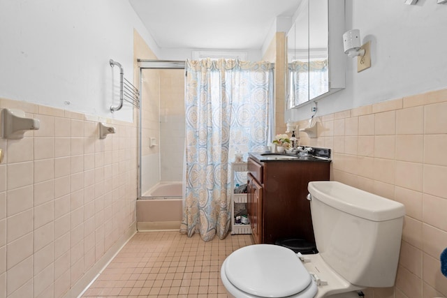 11401 115th St, South Ozone Park, NY 11420 - bathroom with tile walls, shower / bath combination with glass door, tile patterned flooring, toilet, and vanity