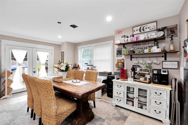 1582 Little Neck Ave, North Bellmore, NY 11710 - dining room with french doors, light tile patterned floors, and recessed lighting