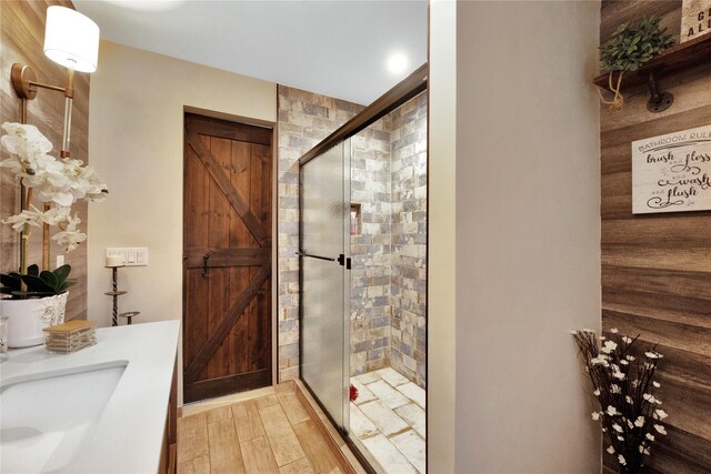 1582 Little Neck Ave, North Bellmore, NY 11710 - full bath featuring a shower stall, vanity, and wood finished floors
