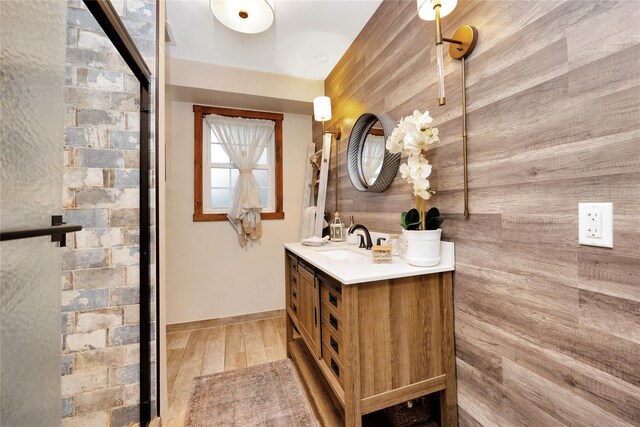 1582 Little Neck Ave, North Bellmore, NY 11710 - full bath featuring double vanity, wood walls, and wood finished floors