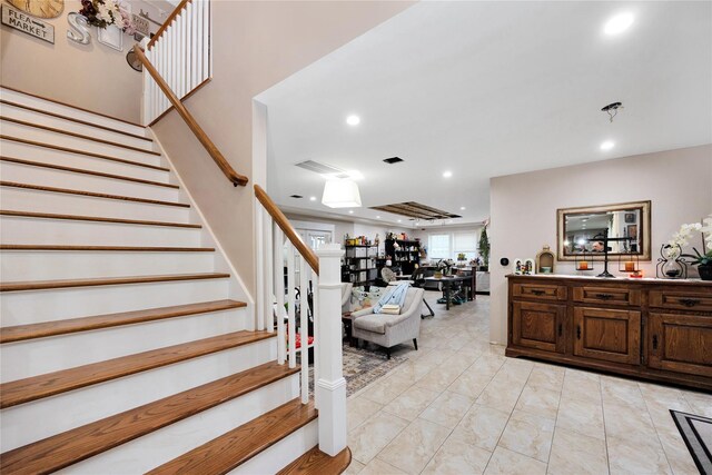 1582 Little Neck Ave, North Bellmore, NY 11710 - staircase featuring recessed lighting