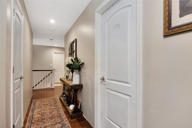 1582 Little Neck Ave, North Bellmore, NY 11710 - hall featuring an upstairs landing, dark wood-style flooring, and recessed lighting