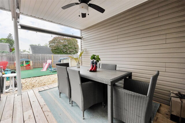 1582 Little Neck Ave, North Bellmore, NY 11710 - wooden terrace with ceiling fan, outdoor dining area, and a fenced backyard