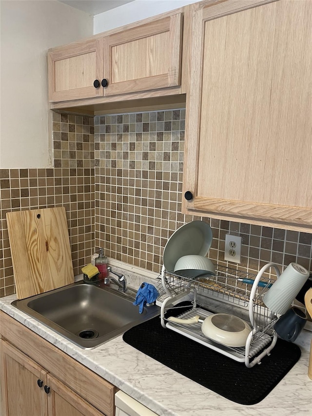 268 Concord Ln, Middletown, NY 10940 - kitchen with backsplash, light brown cabinetry, light countertops, and a sink